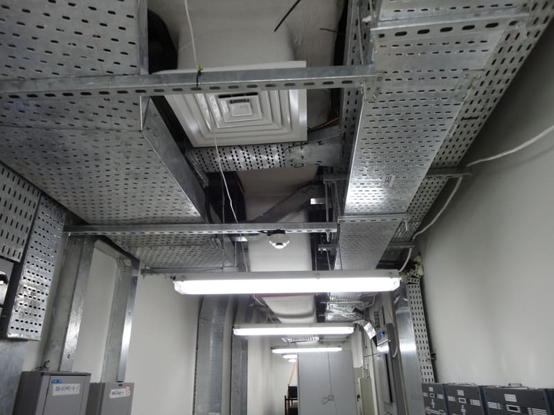 Ceiling services coordinated around a supply air diffuser, ductwork and cable trays